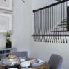 Kitchen staircase with Heights angular wall mount iron balusters