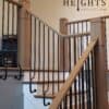Heights collection circular wall mount iron balusters on a staircase