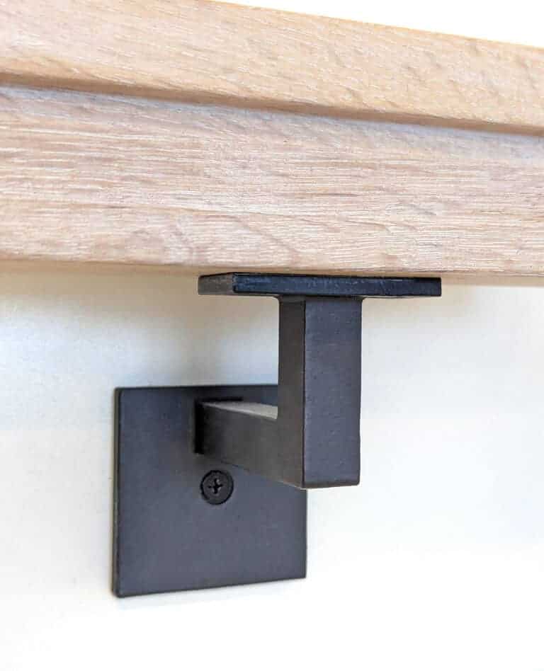 3004 modern handrail bracket supporting a wood handrail on a wall