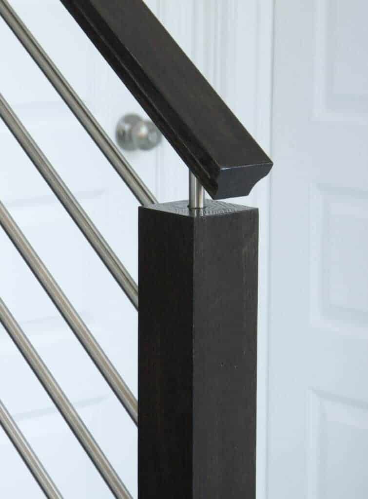 1/2 inch round horizontal bar iron balusters on a stair railing