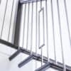 MG_7937.jpg Square wood newel caps on a staircase with iron balusters