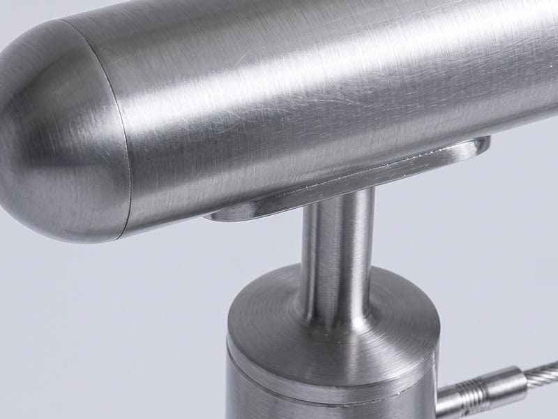 AXIA round stainless steel handrail with end cap on a post-mounted bracket, close-up