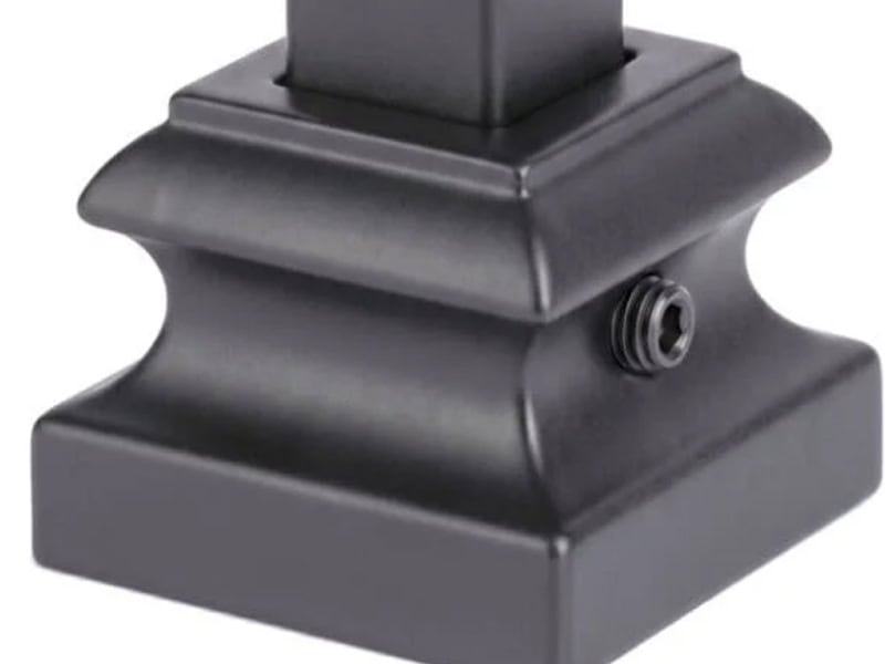 Black square base shoe with a set screw on an iron baluster