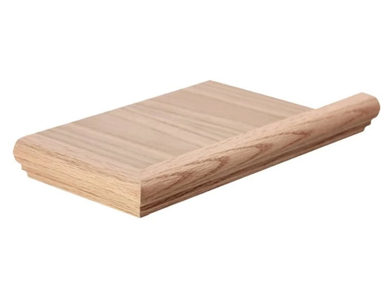 Unfinished oak false end tread cap with a mitered bullnose return, for finishing the open side of a carpeted stair