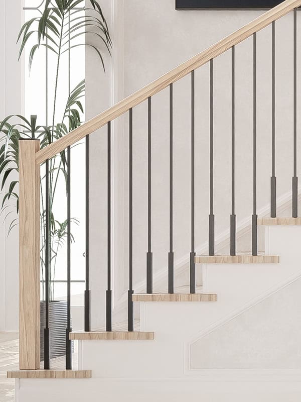 Foundation iron balusters with a 1-inch square base on white oak treads
