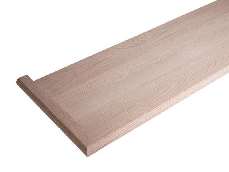 Unfinished red oak mitered return stair tread with a finished end for an open-sided stair