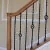Staircase with 16.1.3 single basket solid iron balusters