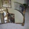 Staircase with 16.1.2 double twist solid iron balusters