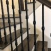 Staircase with 3.2.2 Wentworth triple knuckle hammered iron balusters
