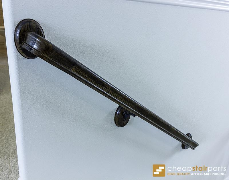 3002 handrail bracket holding a wood handrail on a wall