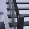 Staircase with 42-60 in retrofit tread kit with riser, red oak