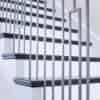 Staircase with 42-60 in retrofit tread kit with riser, red oak