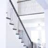 Staircase with 42-60 in retrofit tread kit with riser, red oak