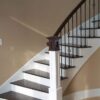 Curved staircase with 16.1.4 double basket iron balusters