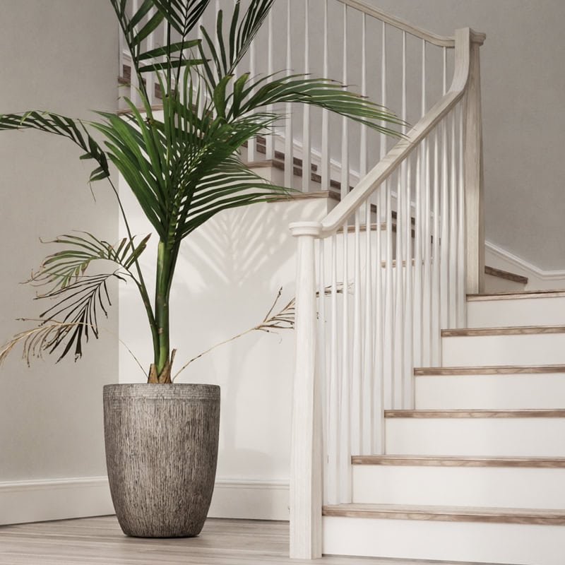 Skandi wood newel post, handrail and balusters on a staircase