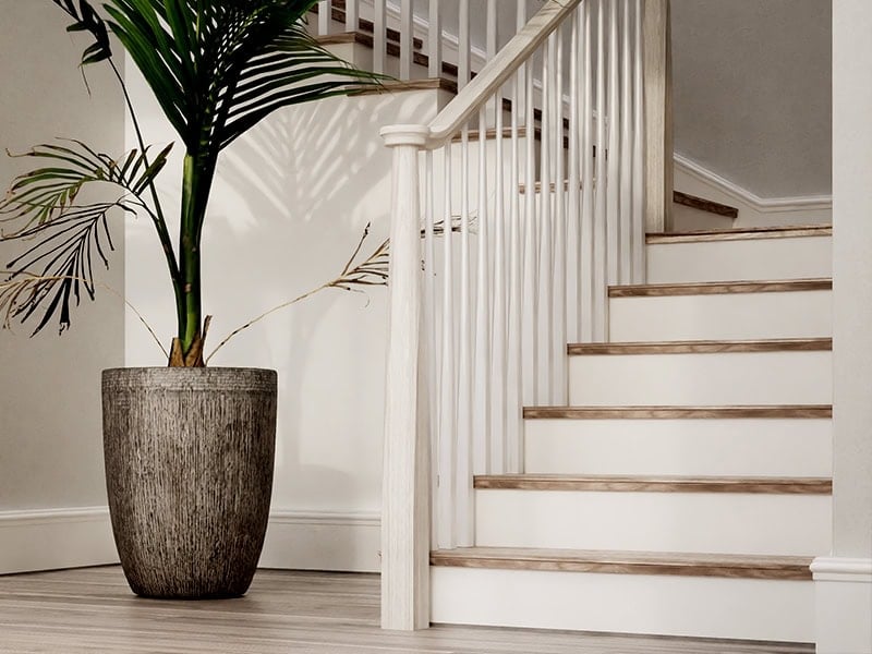 Skandi light wood staircase with tapered round balusters and a tapered newel post