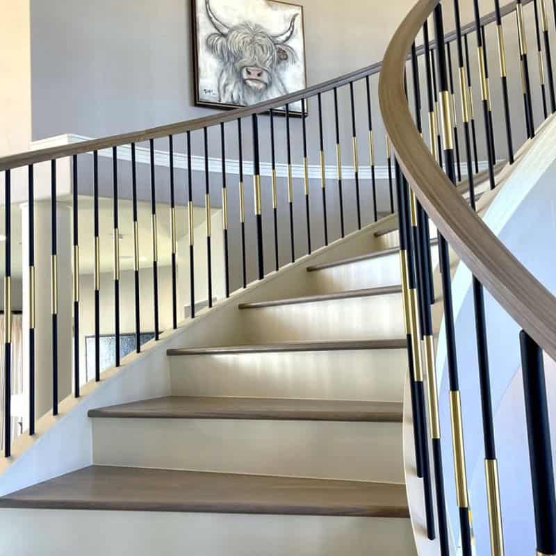 SoHo iron baluster system with adjustable sleeves on a staircase