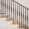 Röhe stabilizer newel post on a staircase with iron balusters
