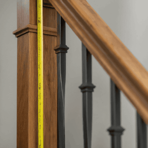 What is the required height for balusters in a railing system?