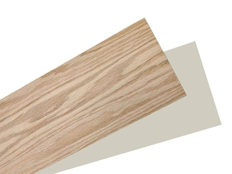 Oak wood stair riser shown with a white primed paint-grade riser
